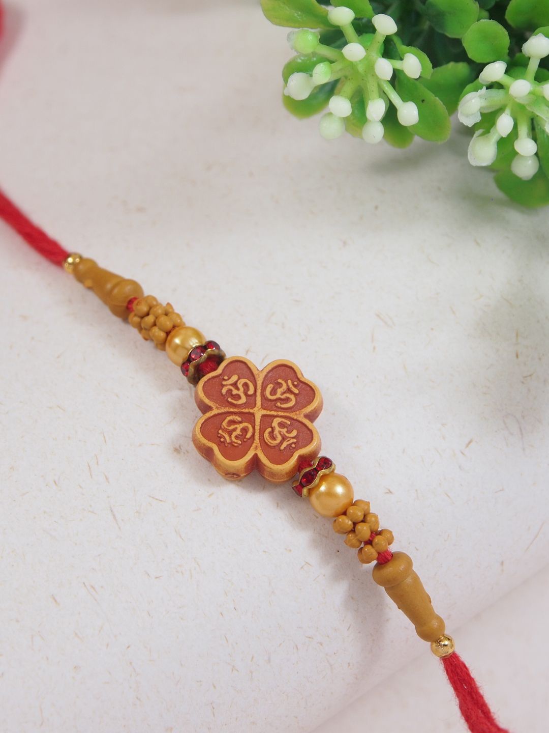 

I Jewels Om Beaded Thread Rakhi With Roli Chawal & Greeting Card, Red