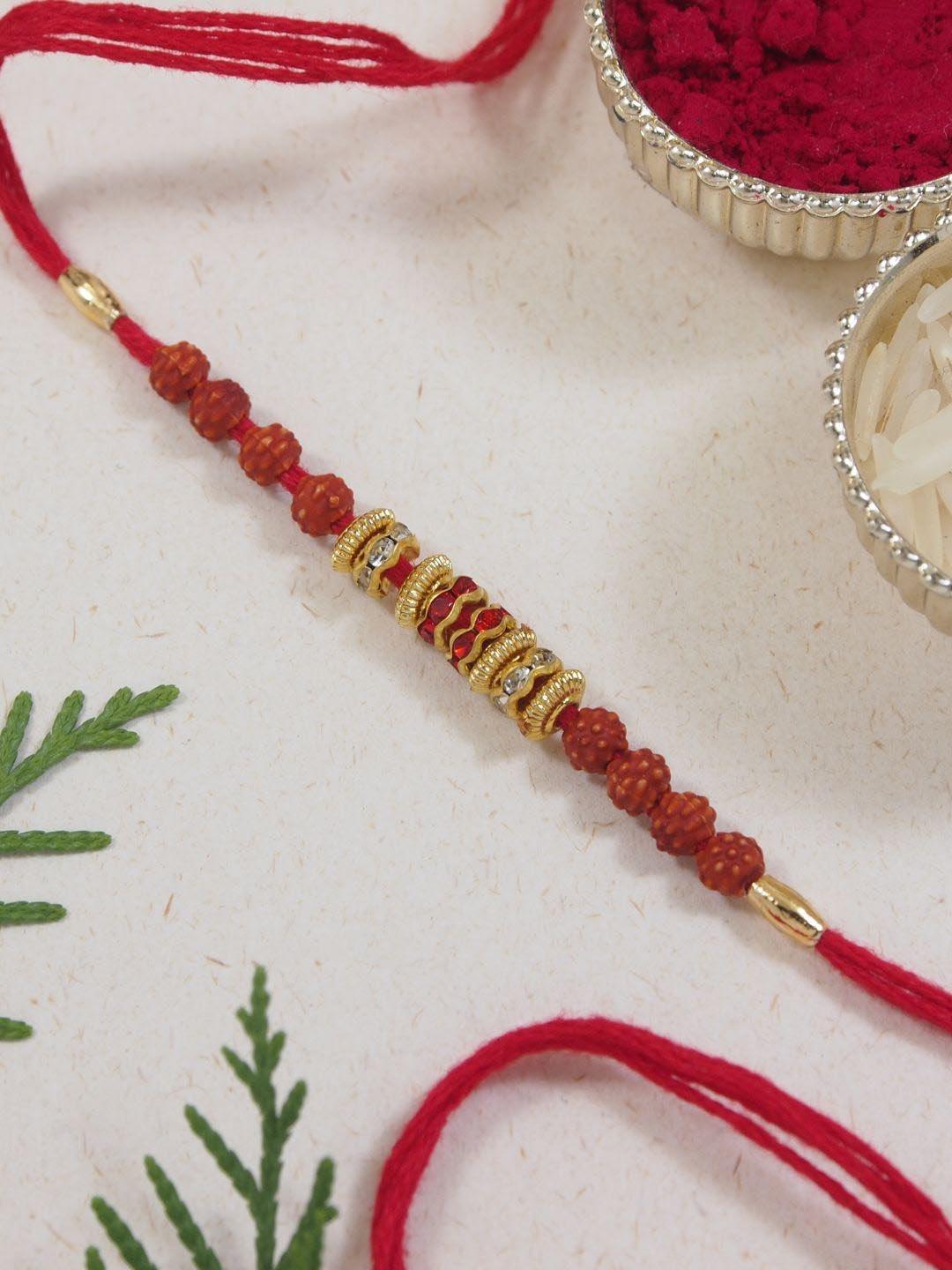 

I Jewels Rudraksha Thread Rakhi With Roli Chawal & Rakshabandhan Card, Red