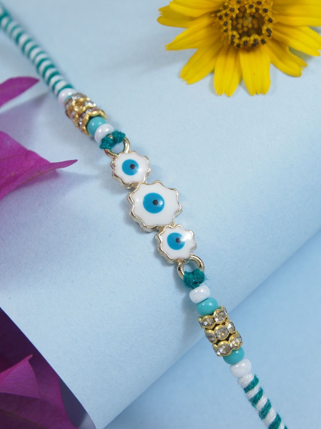 

I Jewels Enamel Evil Eye Thread Rakhi With Roli Chawal & Rakshabandhan Card, Turquoise blue