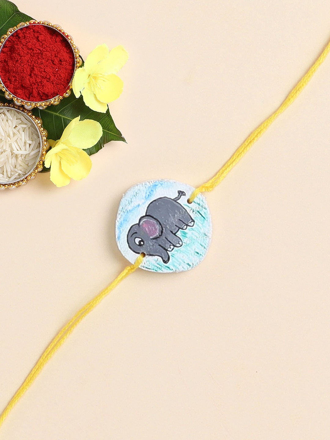 

The Magic Wand Elephant Printed Wooded Thread Rakhi, Yellow