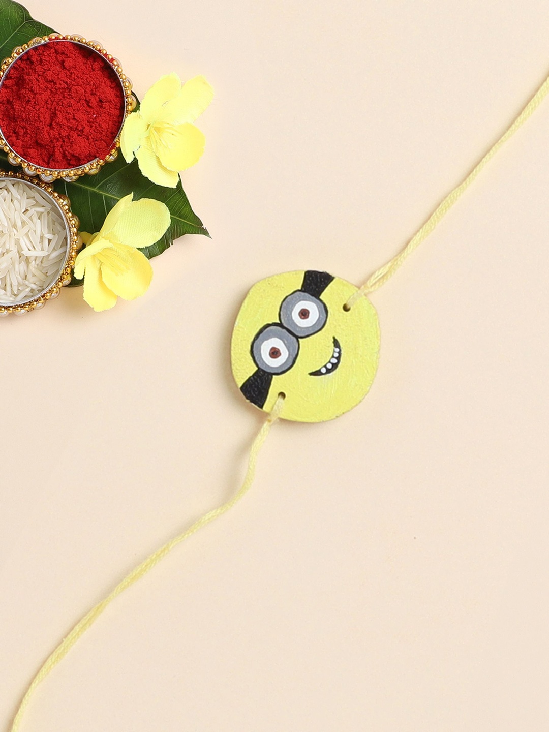 

The Magic Wand Minion Printed Wooded Thread Rakhi, Yellow