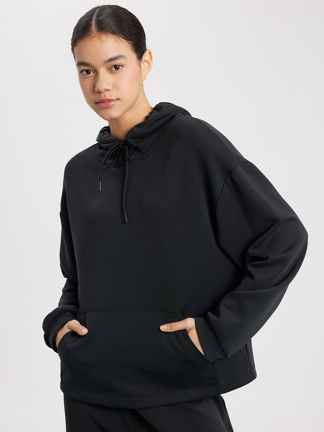 

DeFacto Women Solid Regular Hooded Sweatshirt, Black