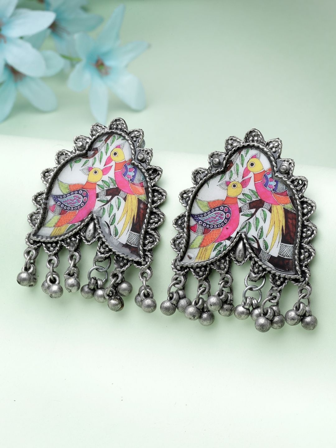 

Moedbuille Silver-Plated Ghungroo Studded Oxidised Peacock Design Drop Earrings