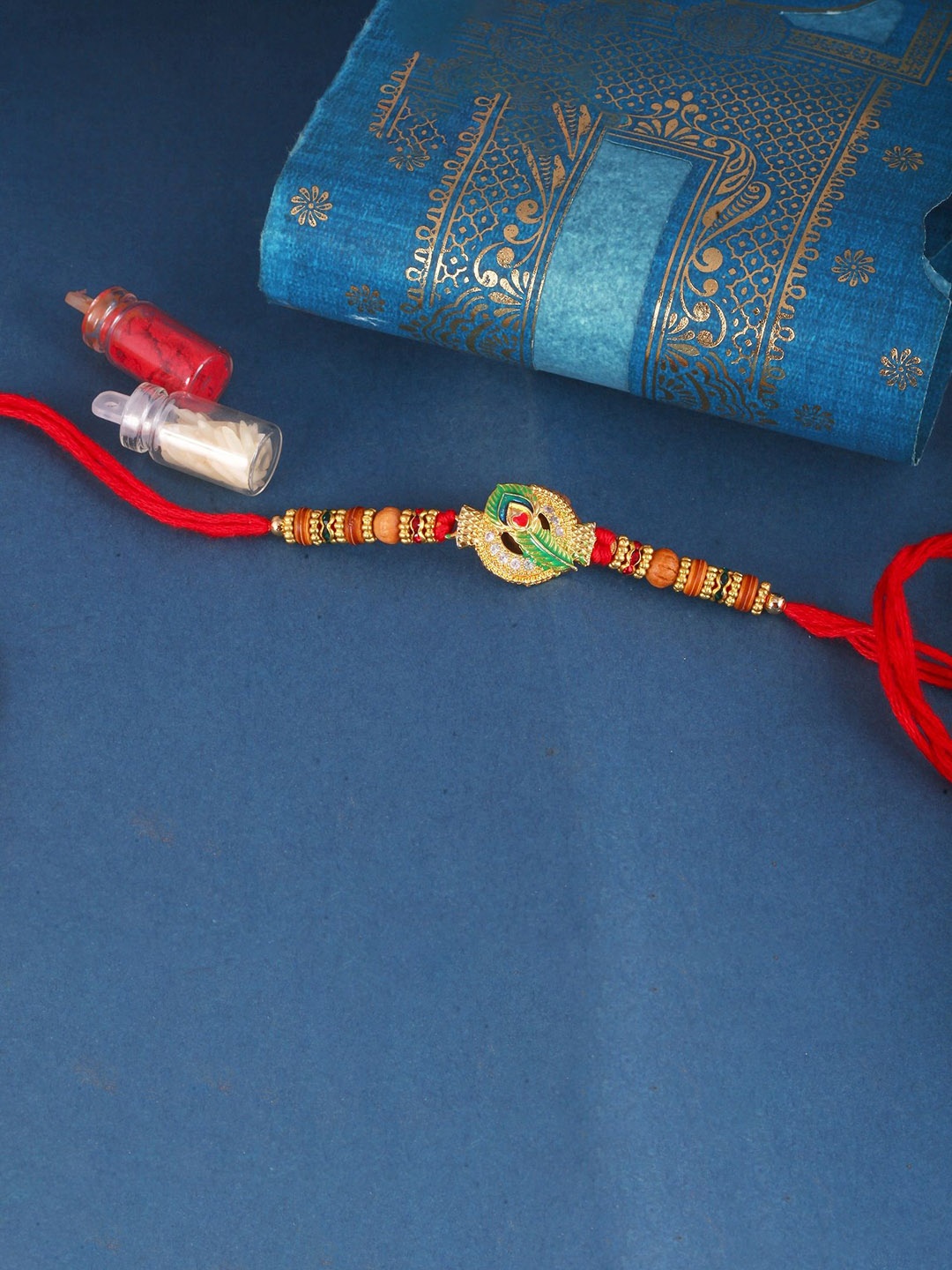 

Vighnaharta Boys Gold And Rhodium Plated Mayur Pankh Peacock Thread Rakhi, Red