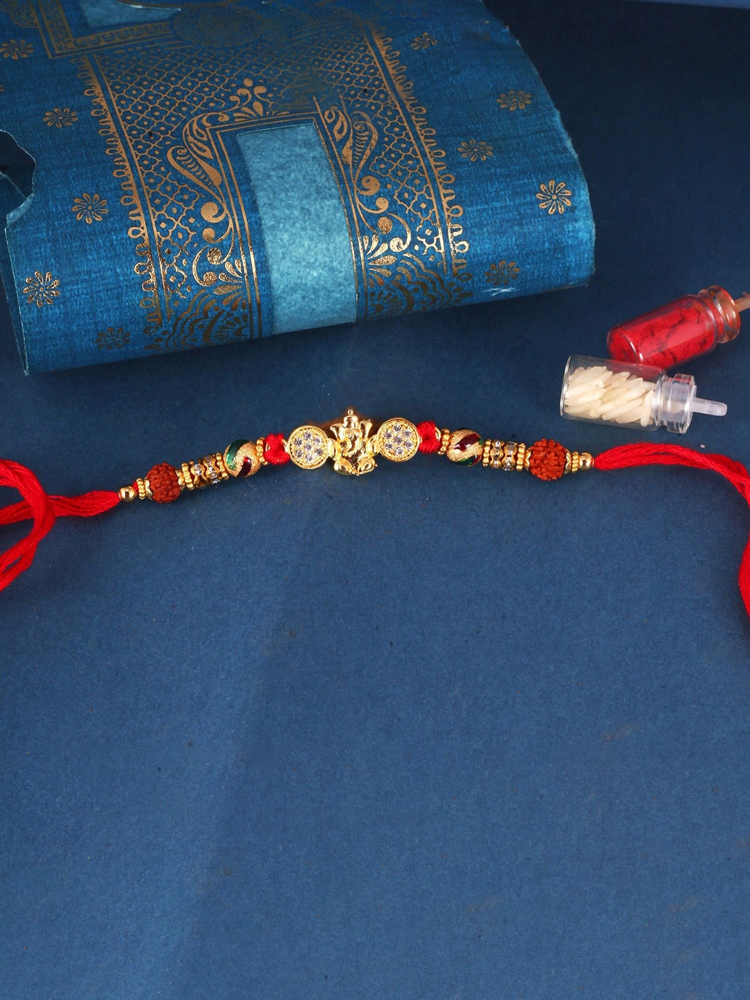 

Vighnaharta Boys Gold And Rhodium Plated CZ Stone Studded Thread Rakhi, Red
