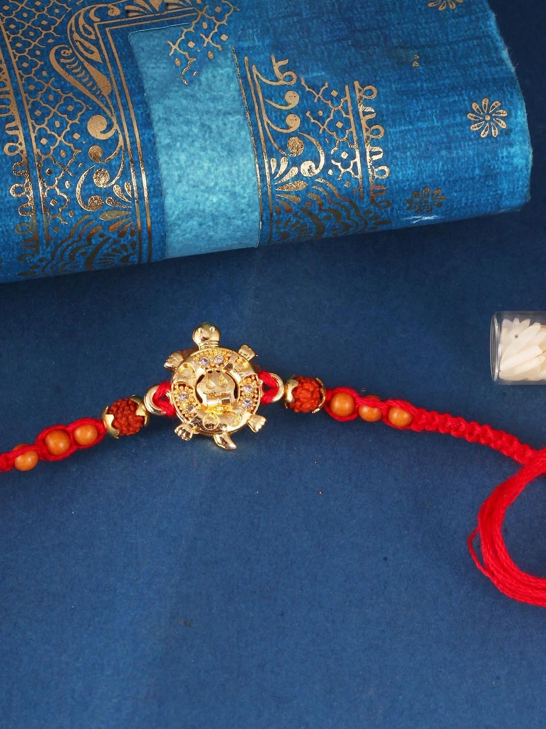 

Vighnaharta Boys Gold And Rhodium Plated CZ Stone Tortoise Thread Rakhi, Red