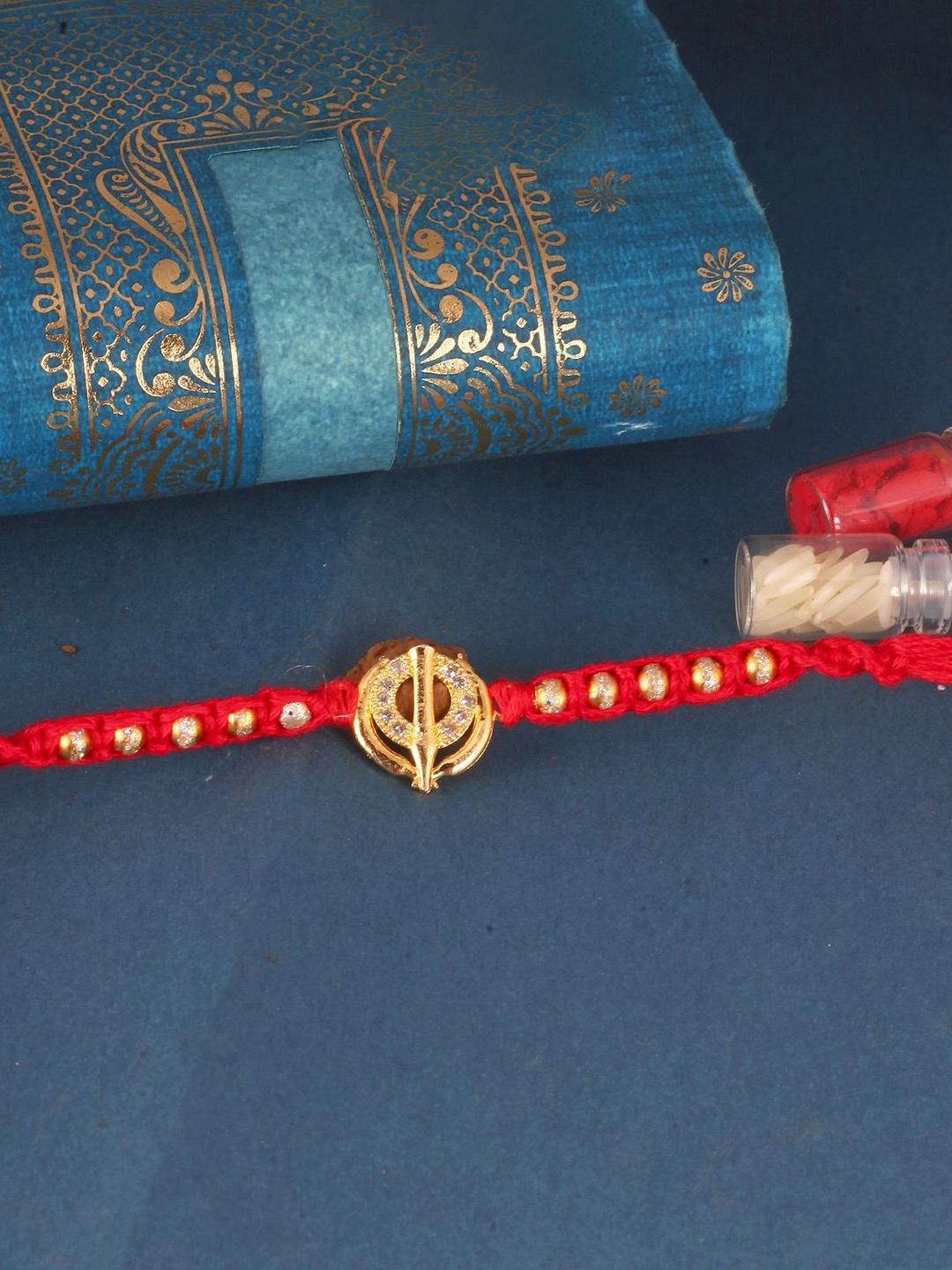 

Vighnaharta Boys Gold And Rhodium Plated Khanda Thread Rakhi, Red