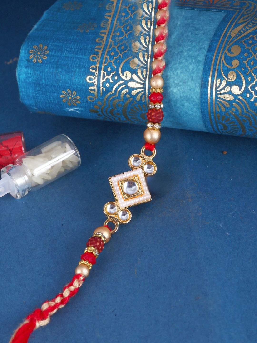 

Vighnaharta Boys Gold And Rhodium Plated CZ Stone Studded Thread Rakhi, Red