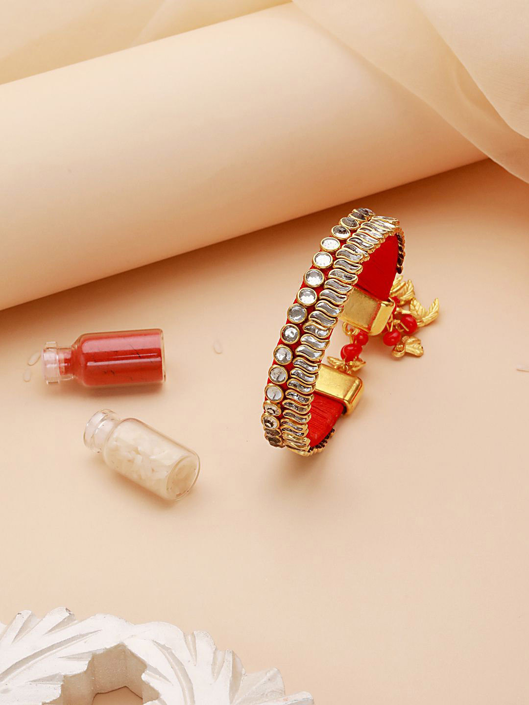 

Anouk Red Kundan-Studded Bhabhi Wraparound Rakhi with Roli Chawal