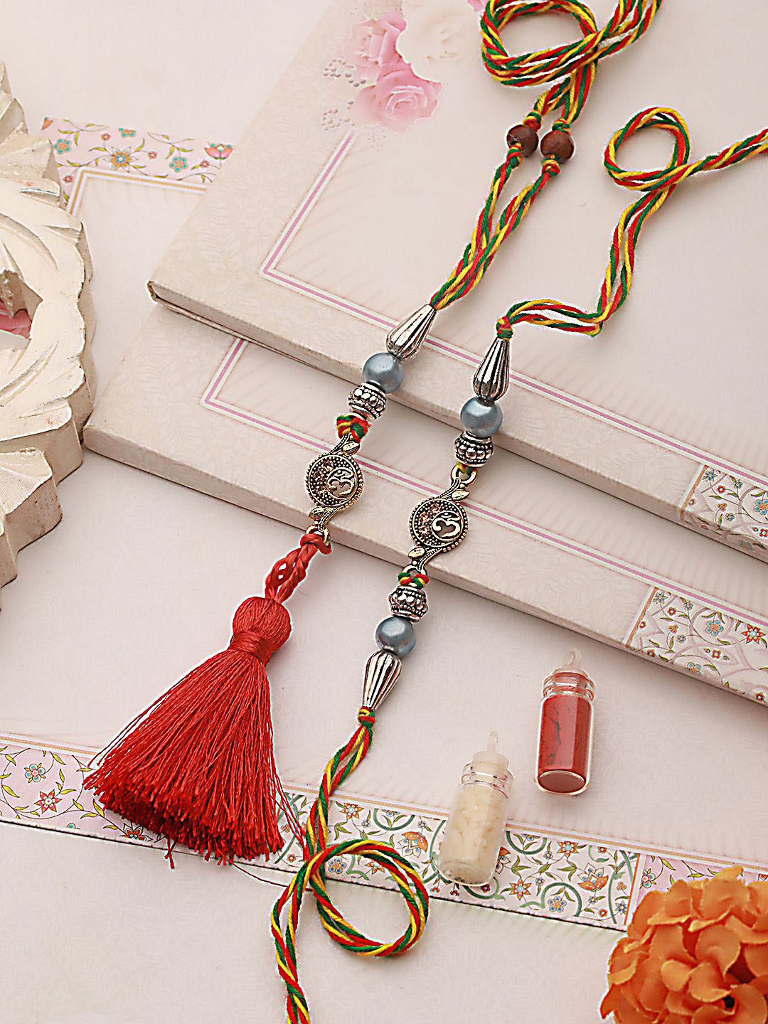 

Anouk Red Set of 2 Pearl-Beaded Bhaiya Bhabhi Rakhi with Roli Chawal