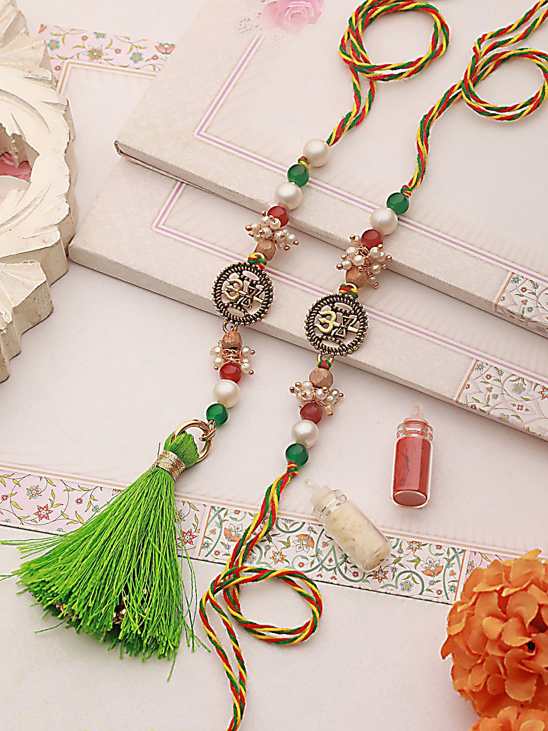 

Anouk Gold-Toned Set of 2 Pearl-Beaded Bhaiya Bhabhi Rakhi with Roli Chawal