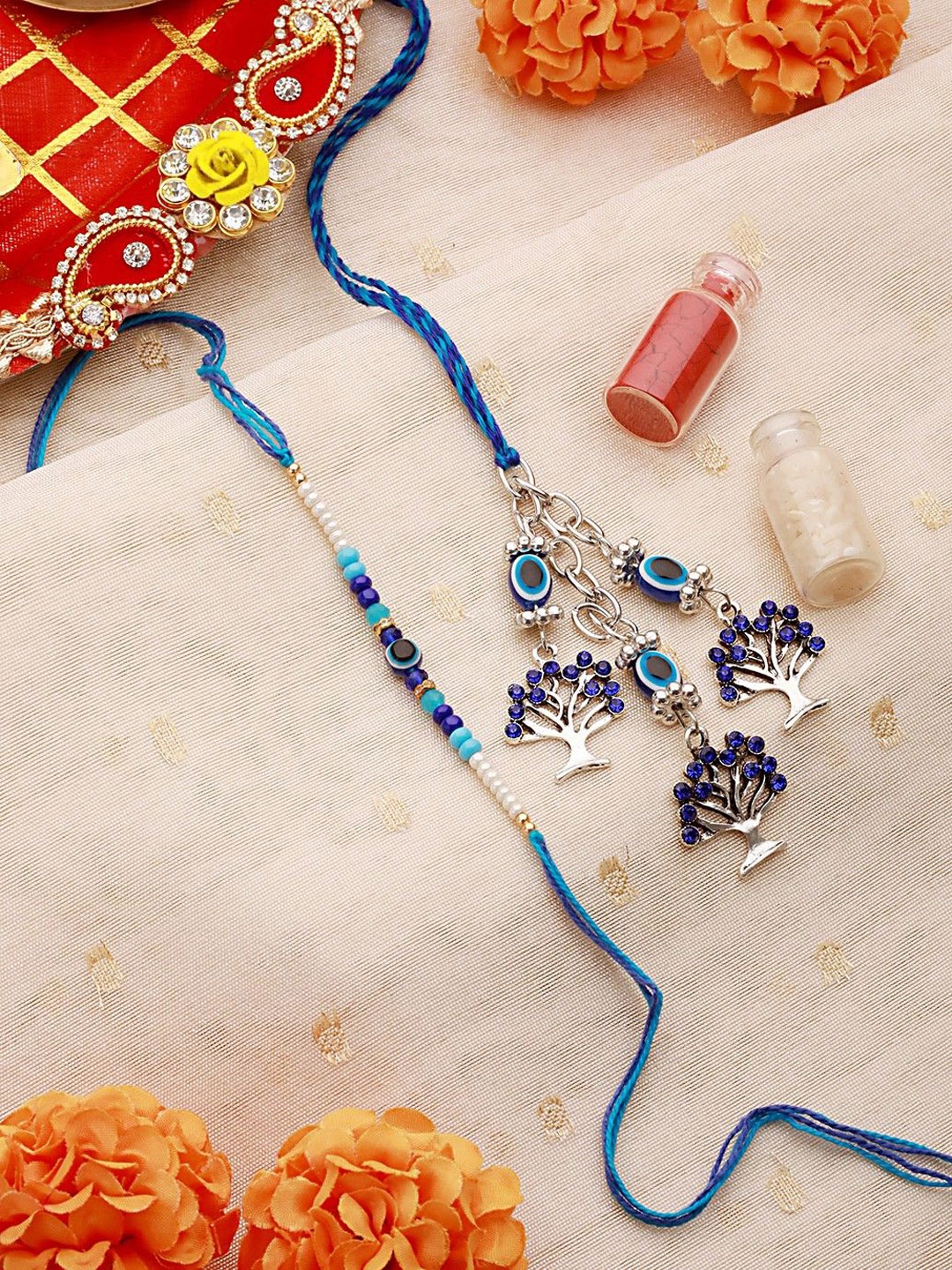 

Sangria Blue Set Of 2 Evil-Eye & Tree Charm Thread & Lumba Rakhis With Roli Chawal