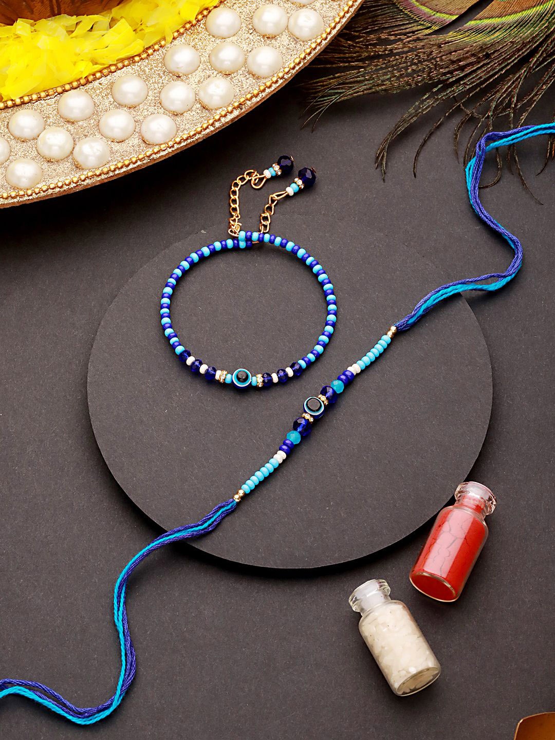 

Sangria Blue Set of 2 Evil Eye Beaded Wraparound & Thread Rakhis With Roli Chawal