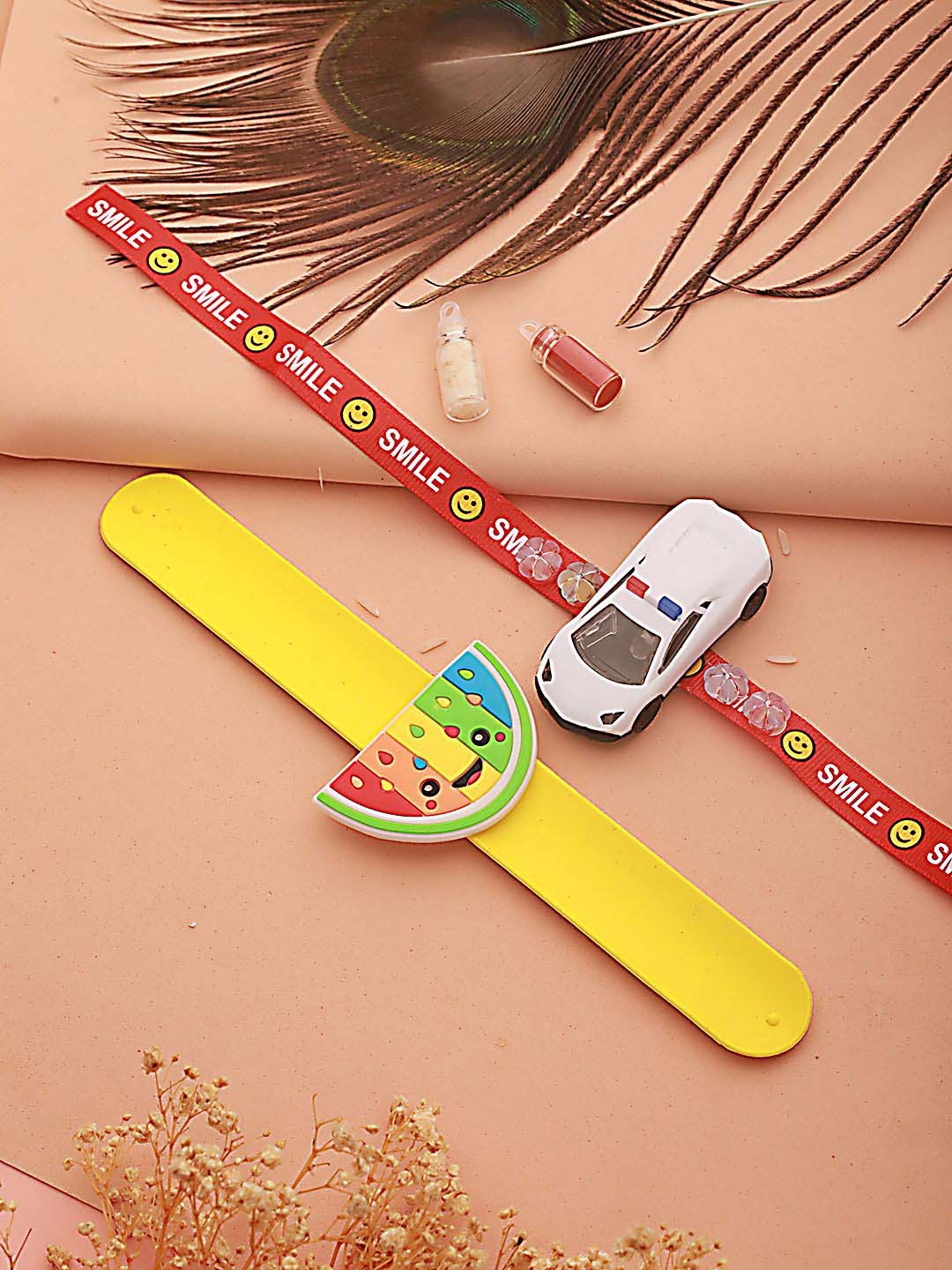 

Kook N Keech Yellow Set of 2 Light Car & Watermelon Band Wraparound Rakhi with Roli Chawal, Red