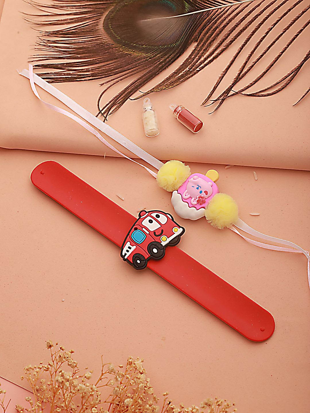 

Kook N Keech Red Kids Set Of 2 Ice Cream & Bus Band Thread Rakhis With Roli & Chawal
