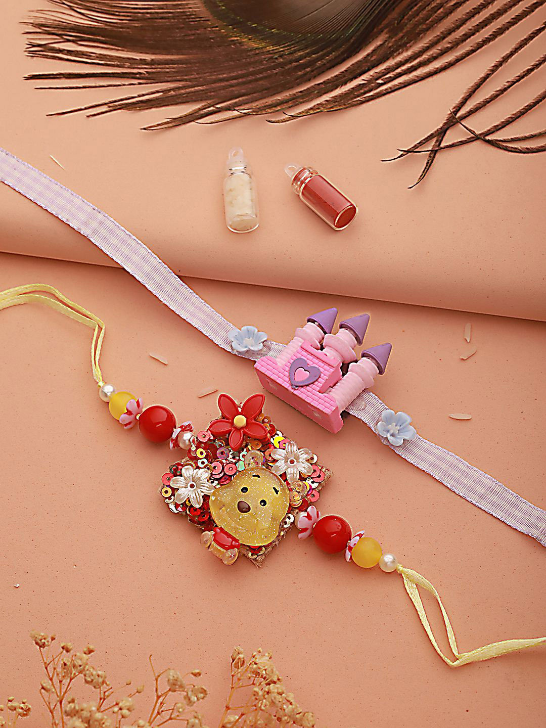 

Kook N Keech Purple Set of 2 Princess Castle Shape Eraser Rakhis with Roli Chawal