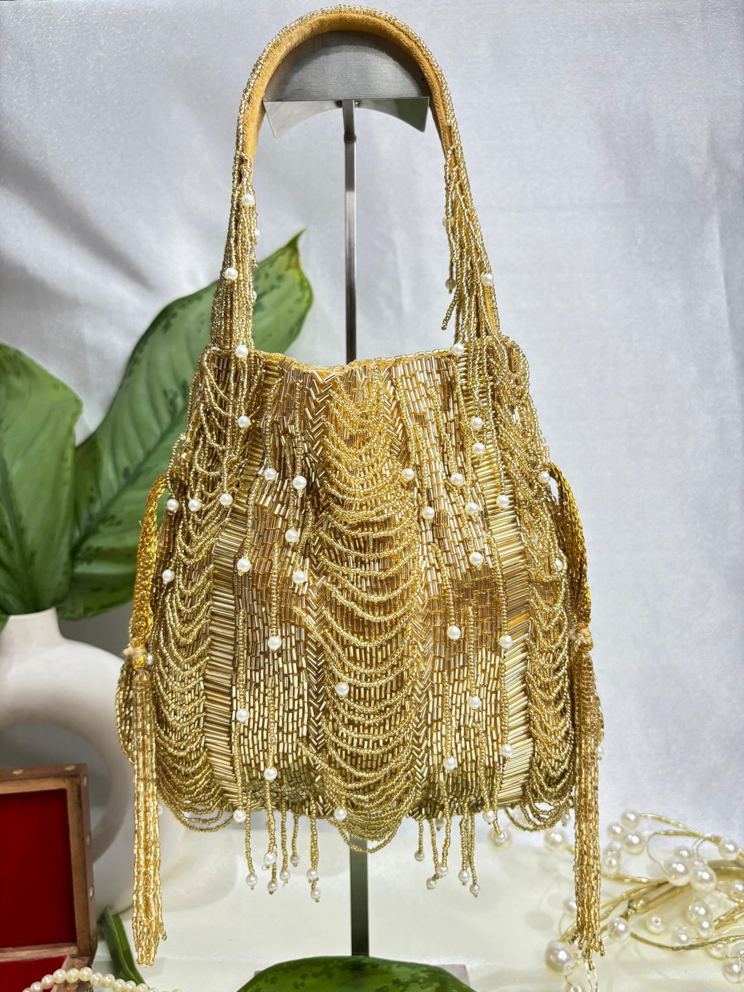 

trendy crafts Embellished Tasselled Potli Clutch, Gold