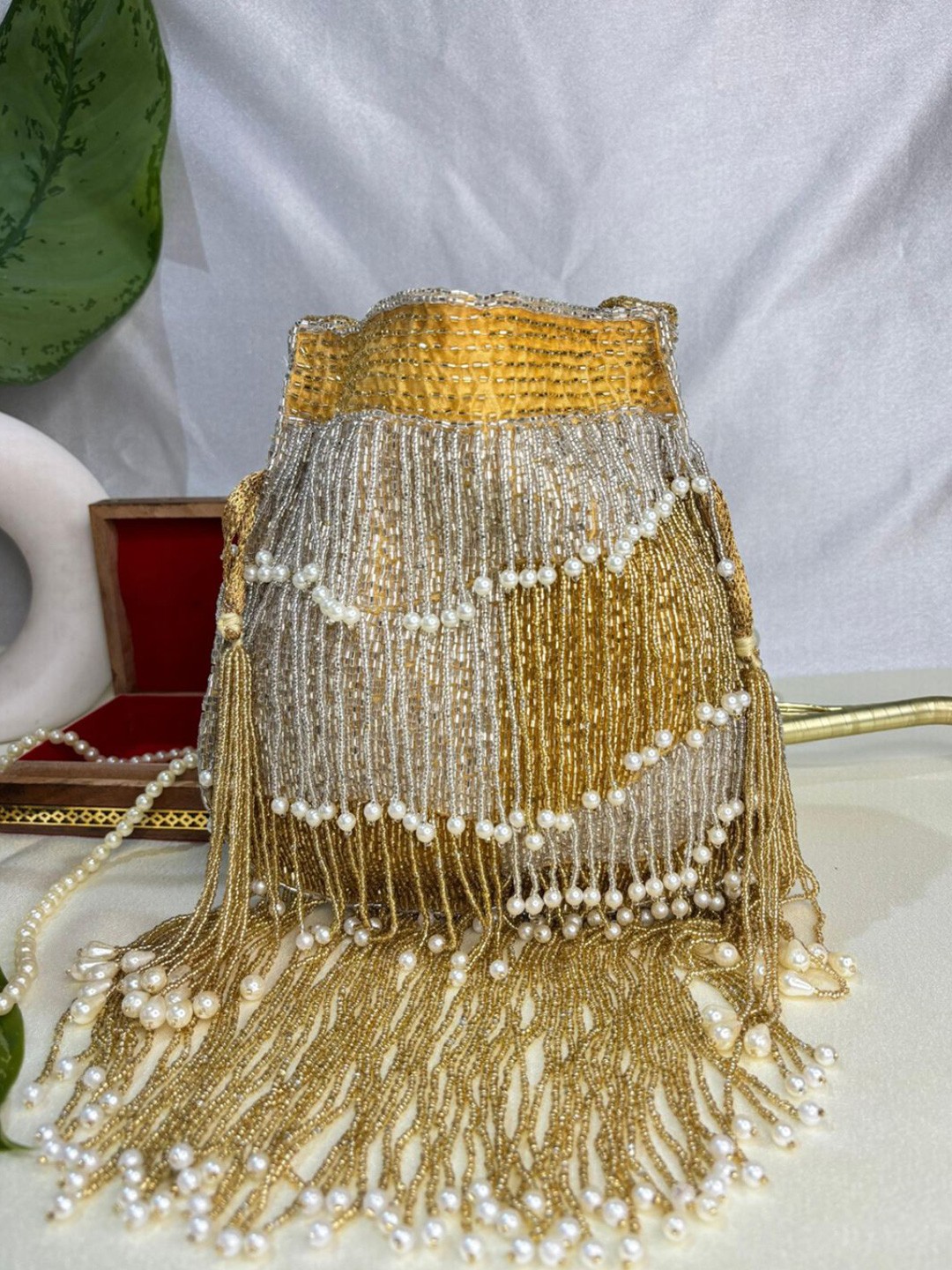 

trendy crafts Embellished Tasselled Potli Clutch, Gold