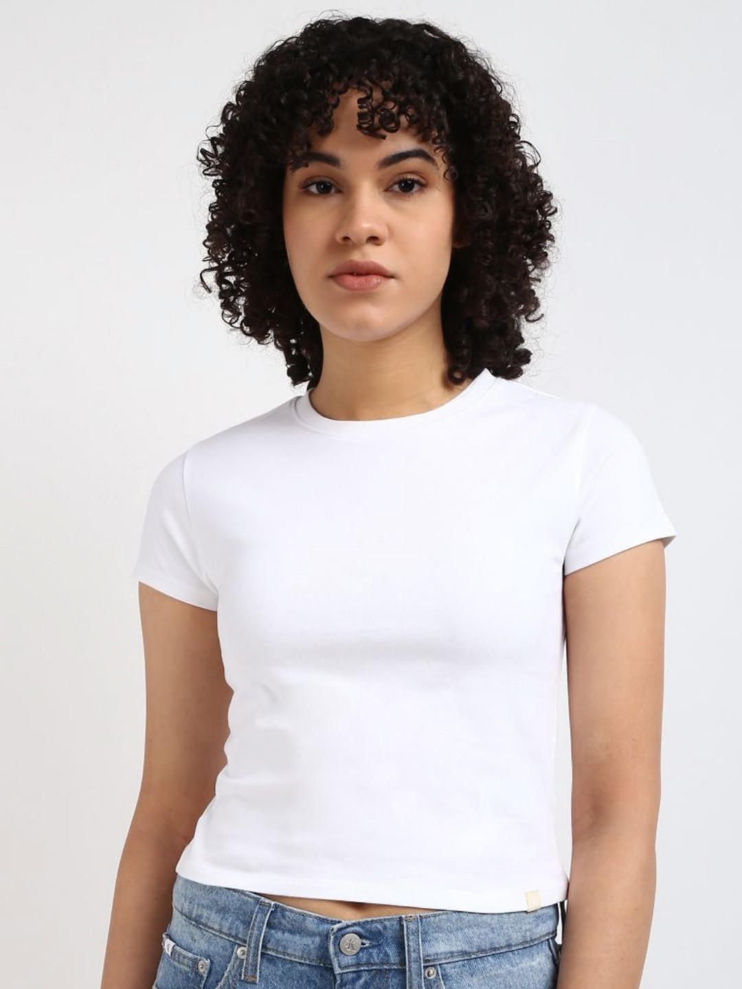 

Calvin Klein Jeans Women Solid Round Neck Cotton Slim Fit Tshirt, White
