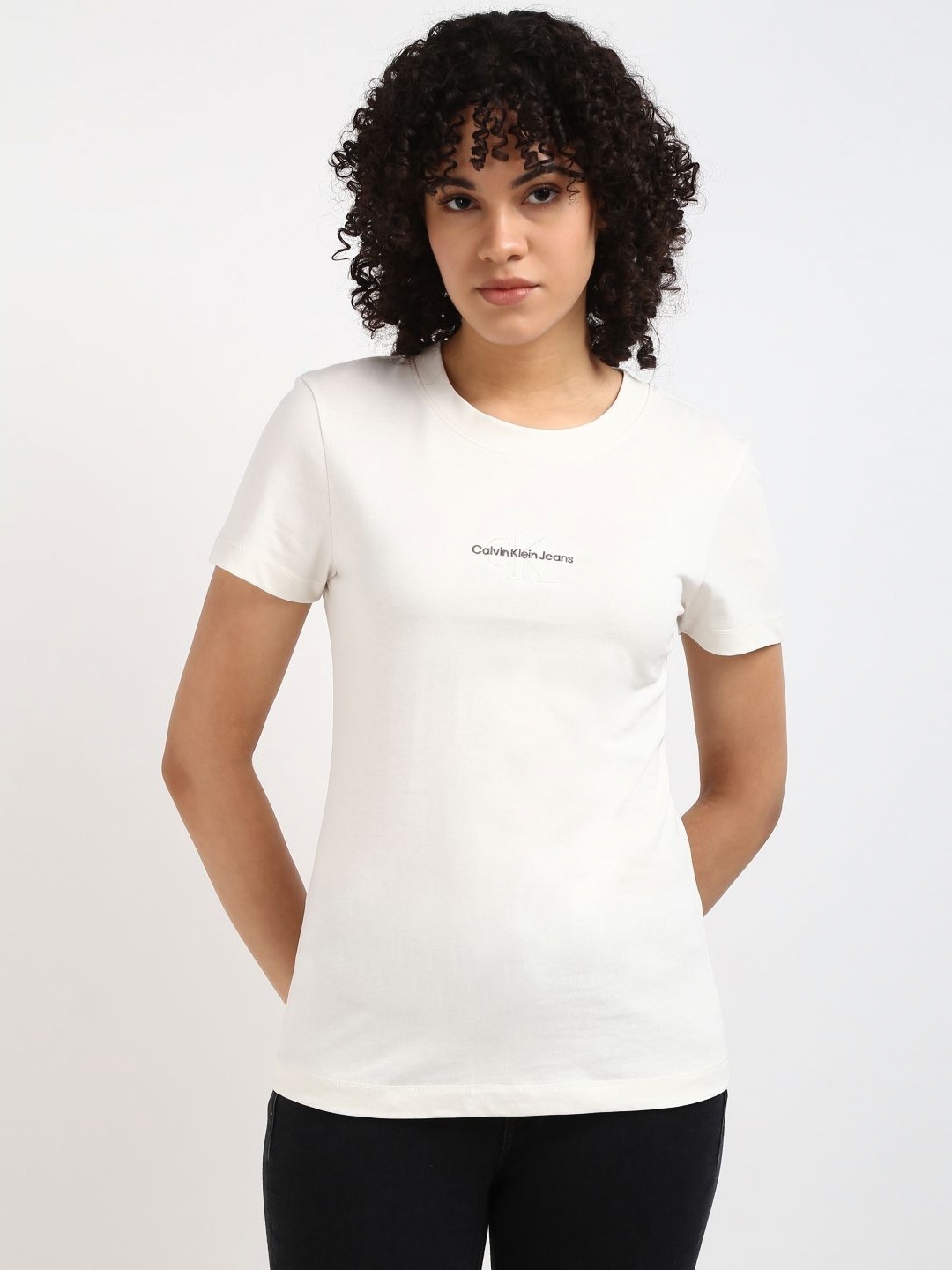 

Calvin Klein Jeans Women Solid Round Neck Cotton Slim Fit Tshirt, White