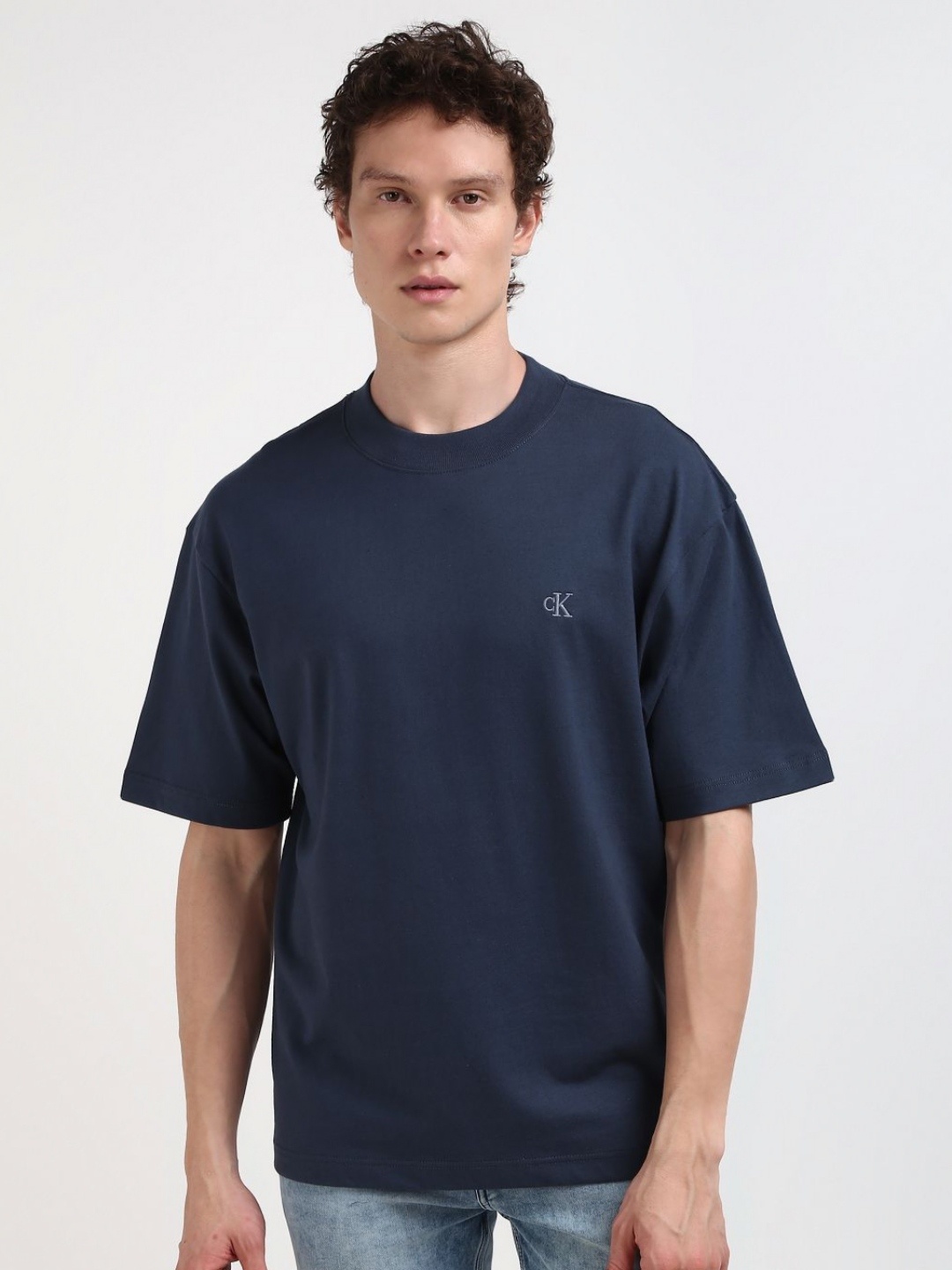 

Calvin Klein Jeans Men Solid Round Neck Cotton Relaxed Fit Tshirt, Blue