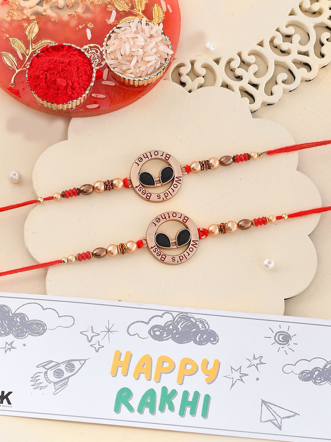 

Kook N Keech Red Beaded Thread Rakhi With Roli Chawal & Greetings Card
