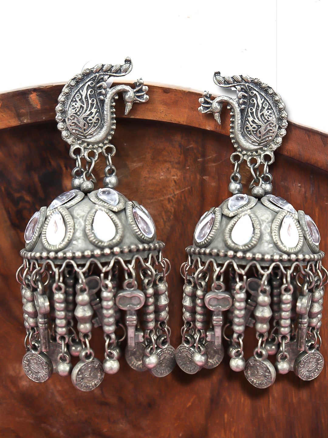 

VAGHBHATT Silver Plated Kundan Studded Peacock Shaped Oxidised Jhumkas