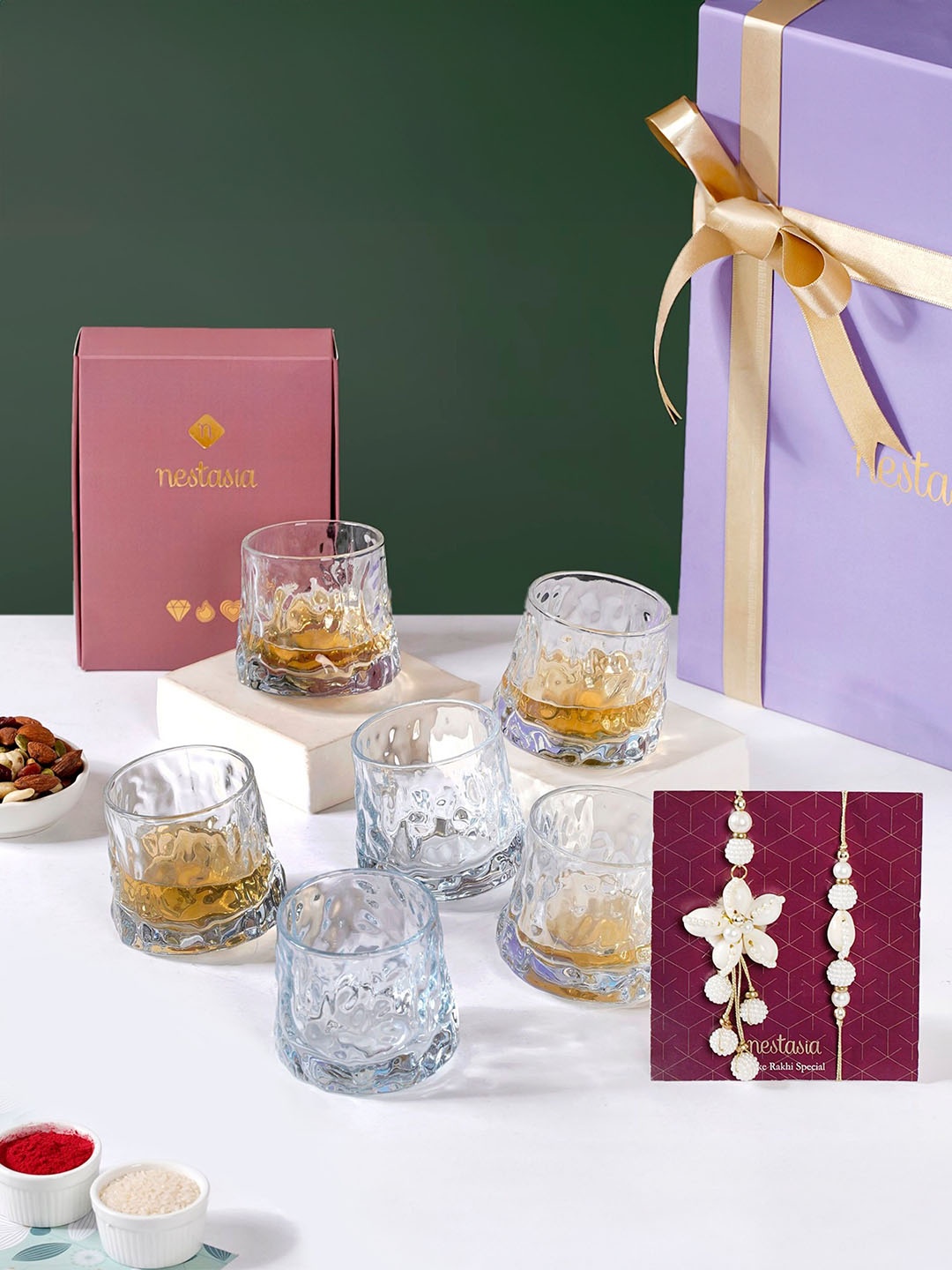 

Nestasia Set Of 8 Bhaiya Bhabhi Rakhi With Shot Glass Roli Chawal & Greeting Card, White