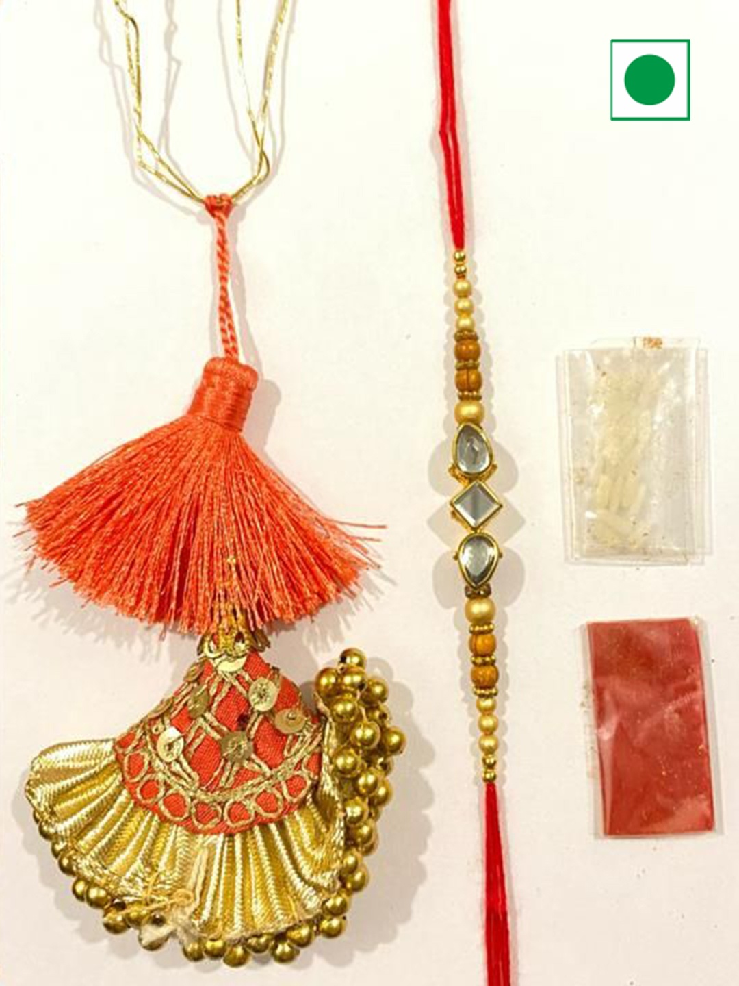 

Wishbox 2-Pcs Rakhi & Sweet Lotus Biscoff Dates With Tikka & Rice, Brown