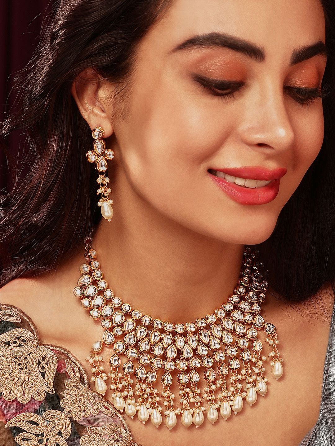 

Priyaasi Gold Plated Kundan Stone Studded & Beaded Jewellery Set
