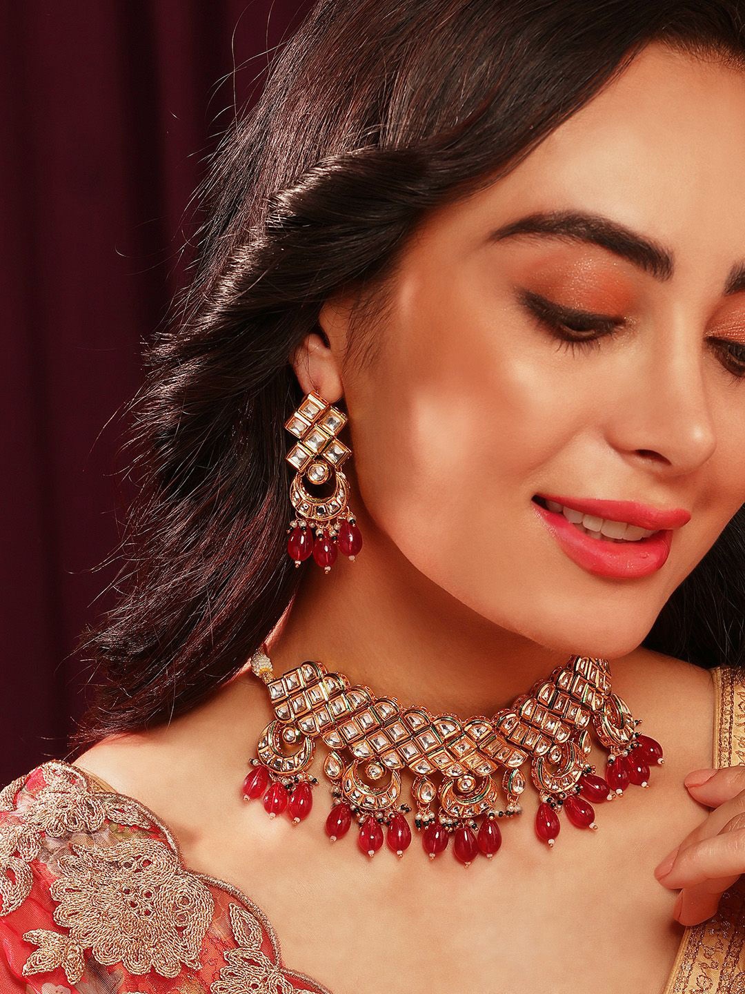 

Priyaasi Gold-Plated Kundan Stone Studded & Beaded Mini Chand Design Choker Jewellery Set