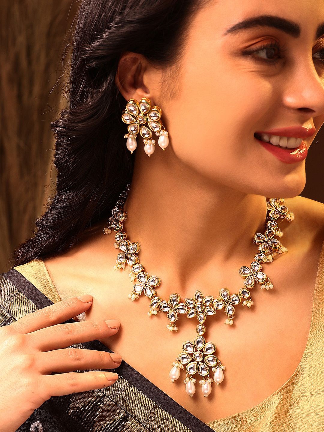 

Priyaasi Gold Plated Opulent Pearl Kundan Stone Studded & Beaded Jewellery Set