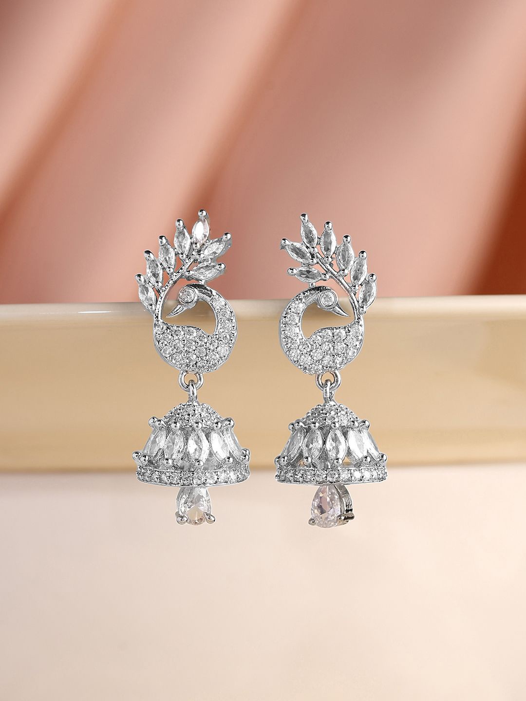 

Priyaasi Silver-Plated AD Stone Studded Peacock Shaped Jhumkas