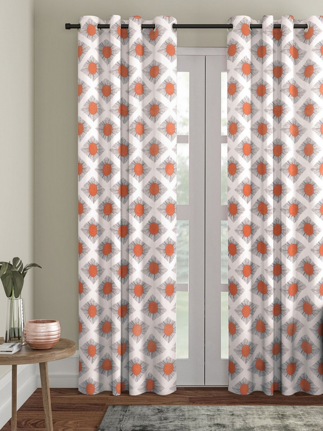 

Myntra Elegant Homes Off White & Orange Geometric Room Darkening Door Curtain