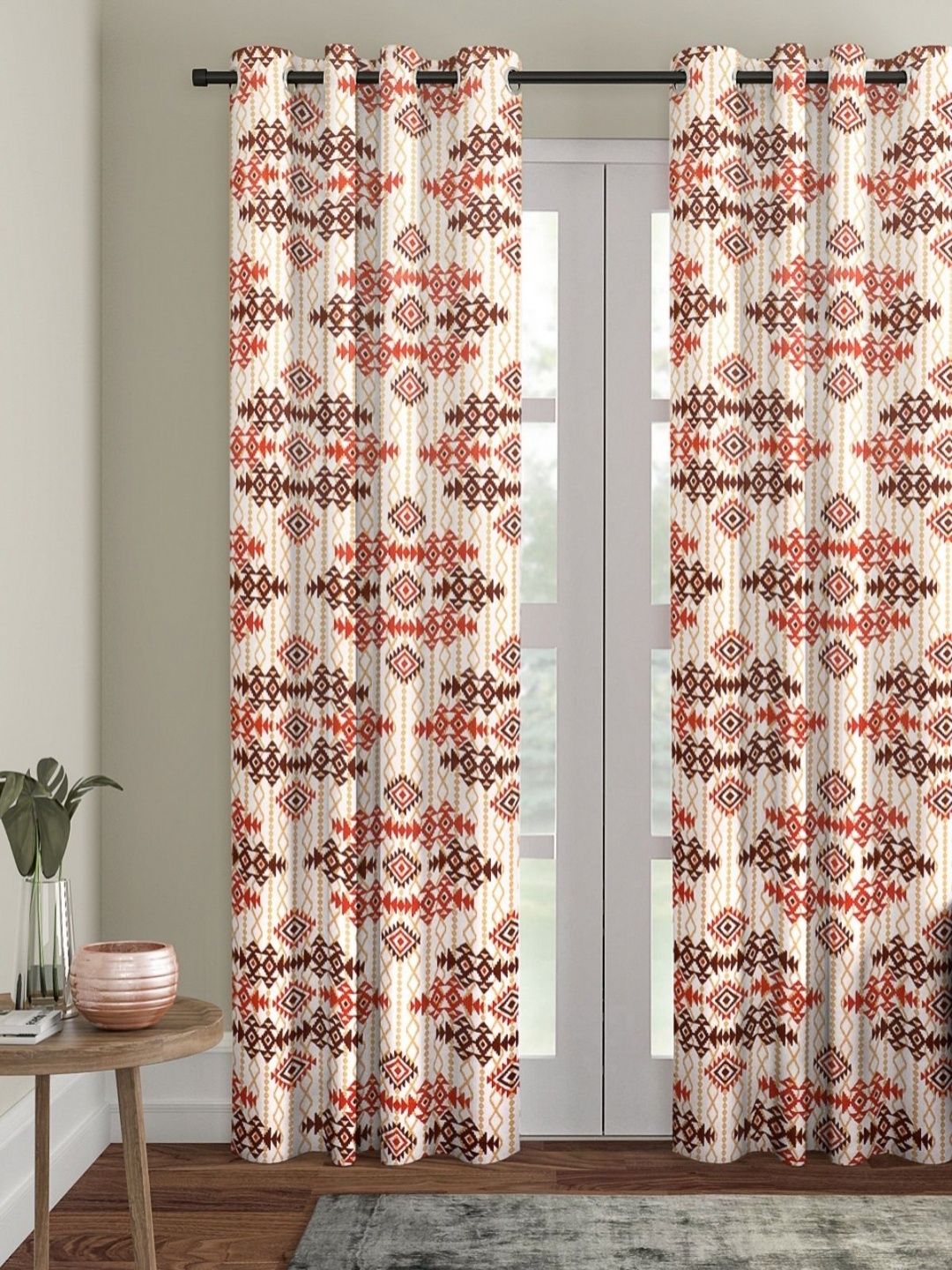 

Myntra Elegant Homes Cream & Orange Ethnic Motifs Room Darkening Door Curtain