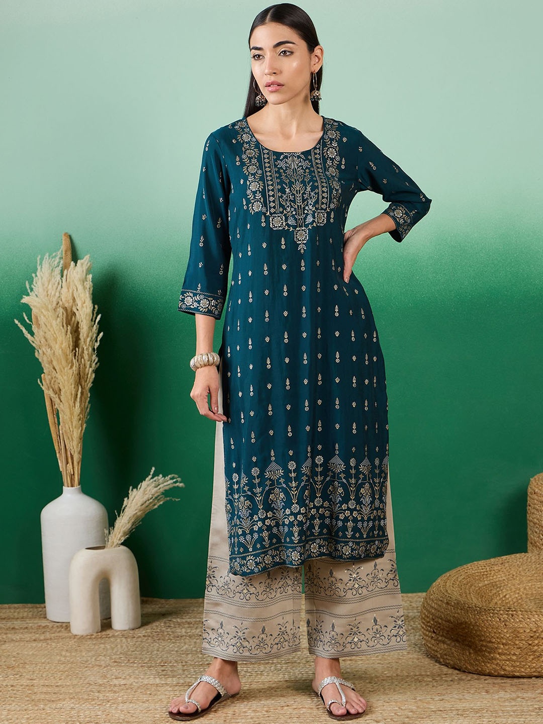 

Sangria Blue & Grey Floral Embroidered Round Neck A-Line Kurta With Palazzo