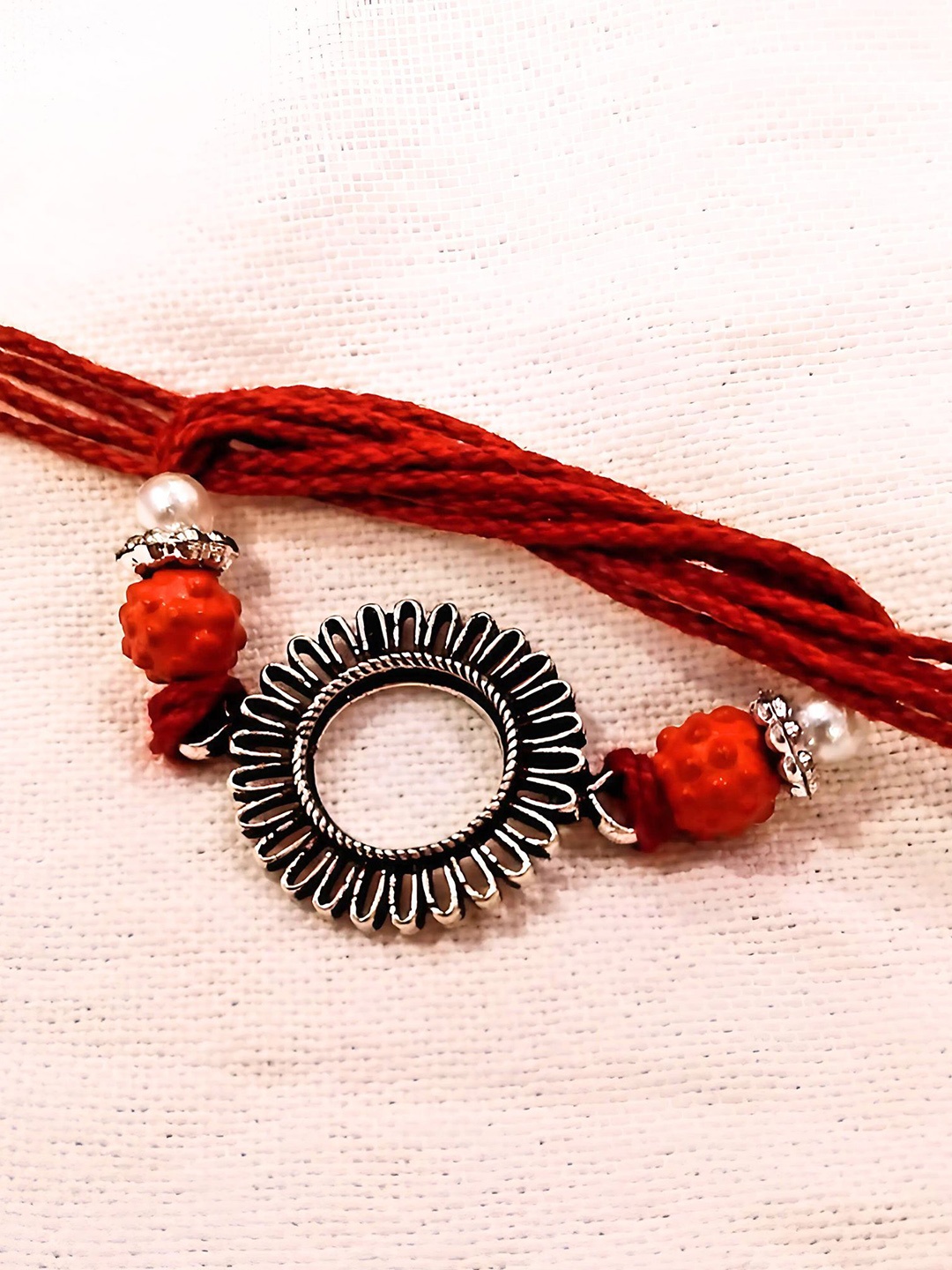 

Sangria Silver Plated Round Sun Shape Thread Rakhi