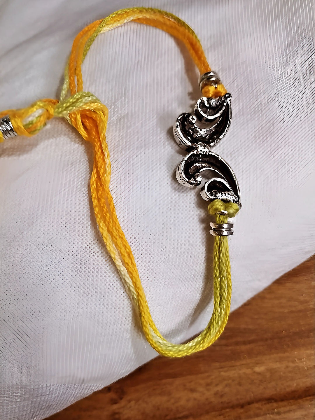 

Sangria Silver-Plated Unique Butterfly Shaped Thread Rakhi