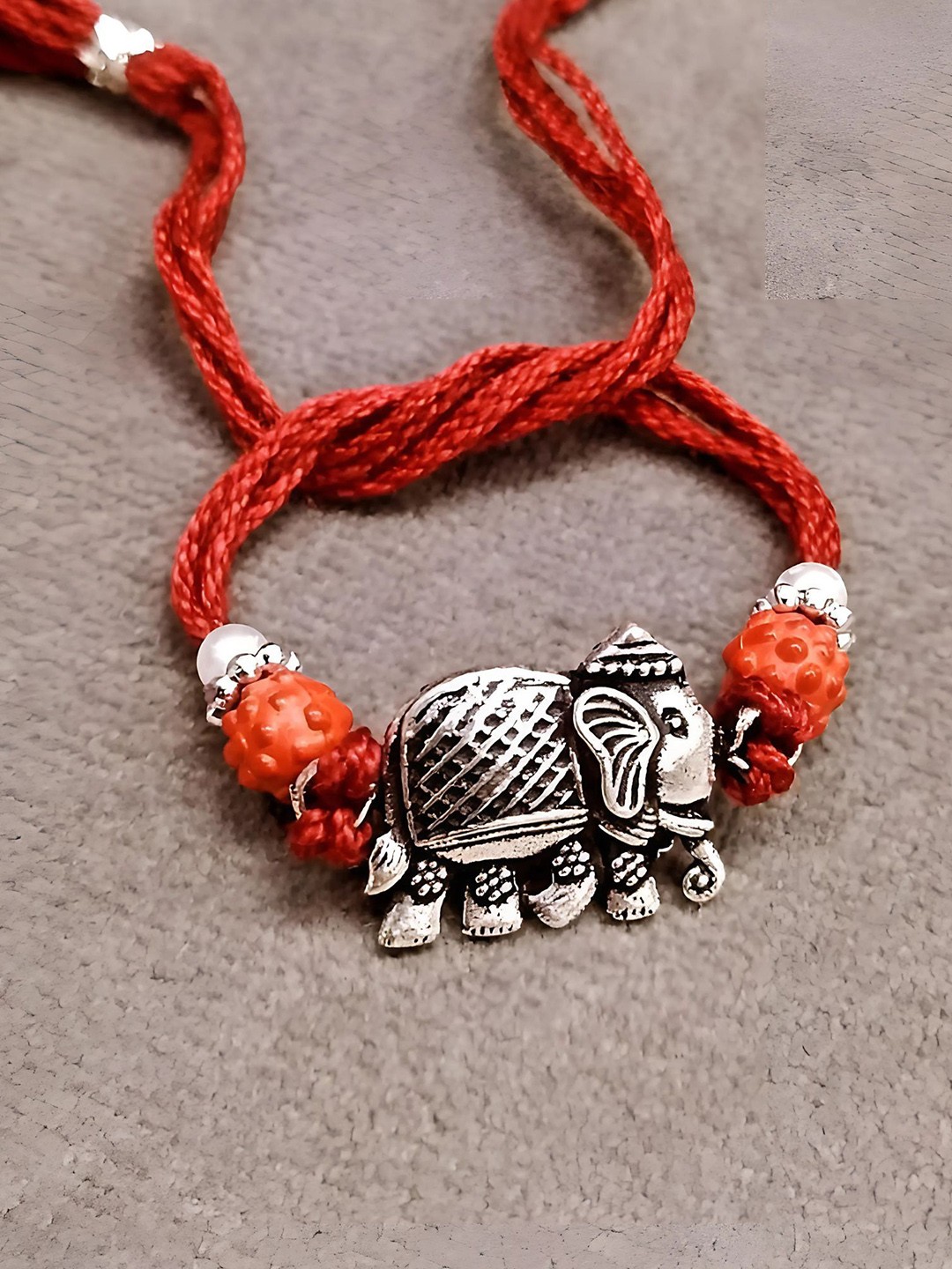 

Sangria Silver Plated Elephant Thread Rakhi, Red