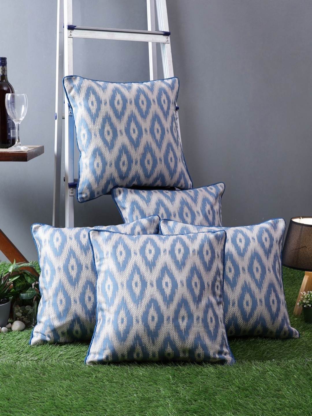 

Myntra Elegant Homes Blue & White 5 Pieces Geometric Printed Square Cushion Covers