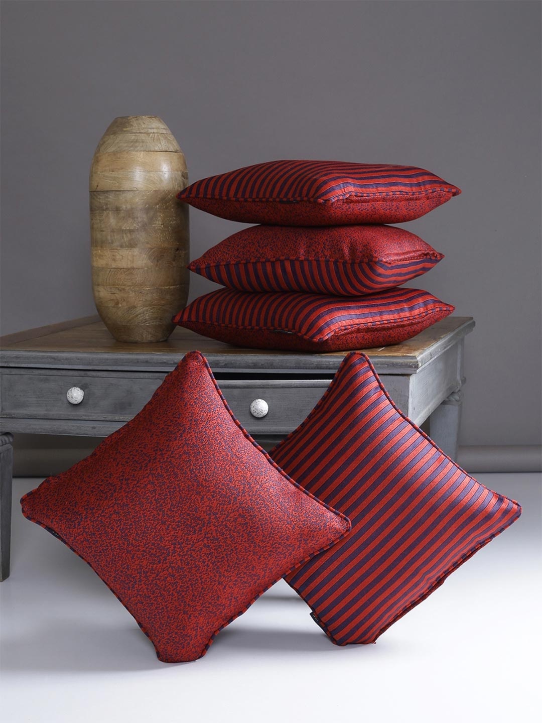 

Myntra Elegant Homes Maroon & Navy Blue 5 Pieces Striped Square Cushion Covers