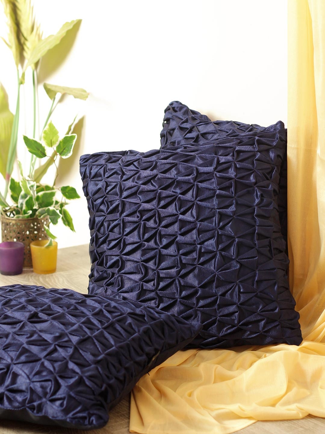 

Myntra Elegant Homes Navy Blue 3 Pieces Geometric Textured Square Cushion Covers