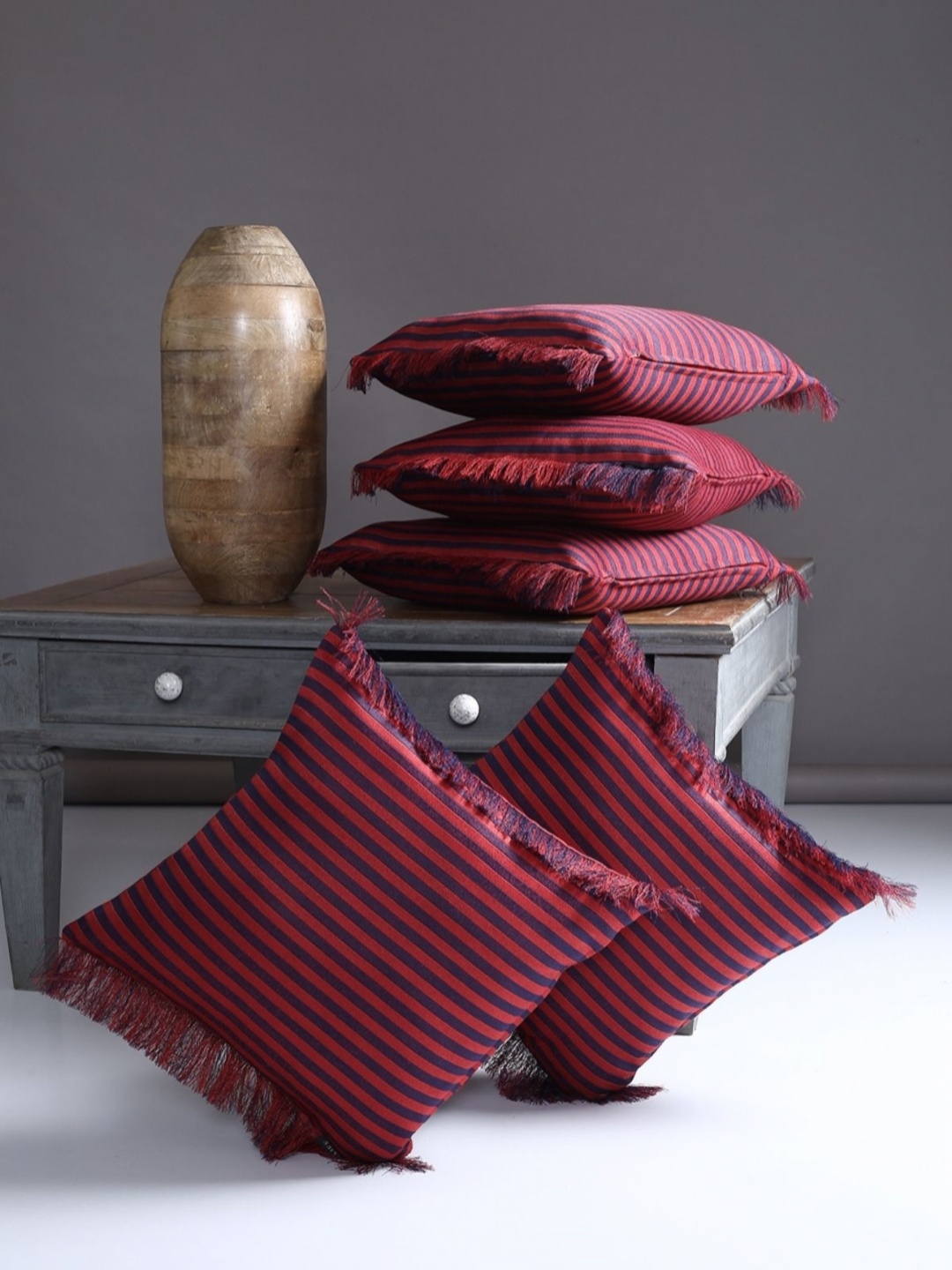 

Myntra Elegant Homes Maroon & Blue 5 Pieces Striped Square Cushion Covers