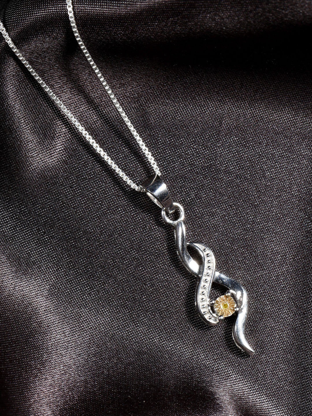 

Exotic India Sterling Silver Twist Pendant