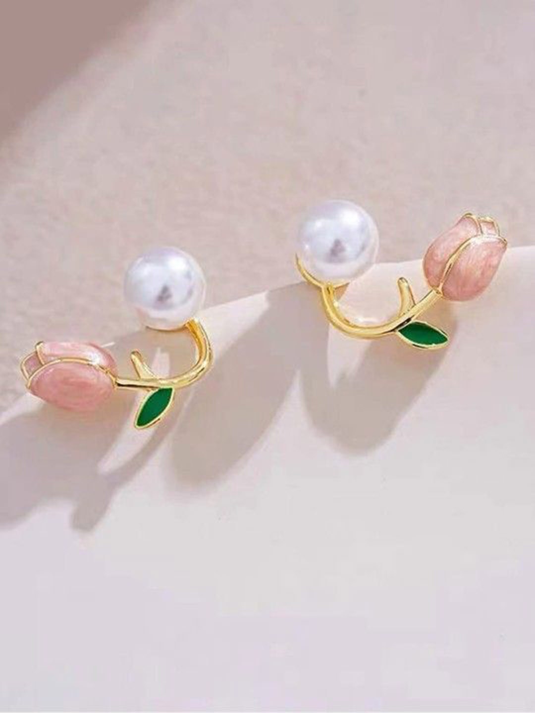 

Xivir Gold-Plated Pearl Beaded Leaf Shaped Studs Earrings