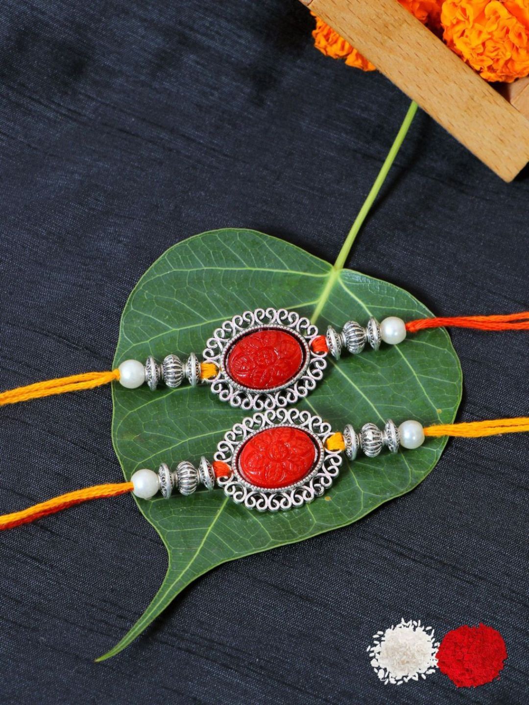 

Crunchy Fashion Set Of 2 Lord Ganesha Square Design Rakhi With Roli Chawal, Red