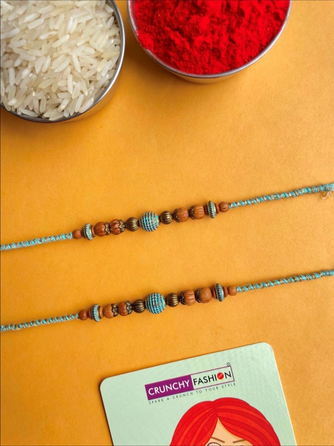 

Crunchy Fashion Set Of 2 Beaded Thread Rakhi With Roli Chawal, Blue