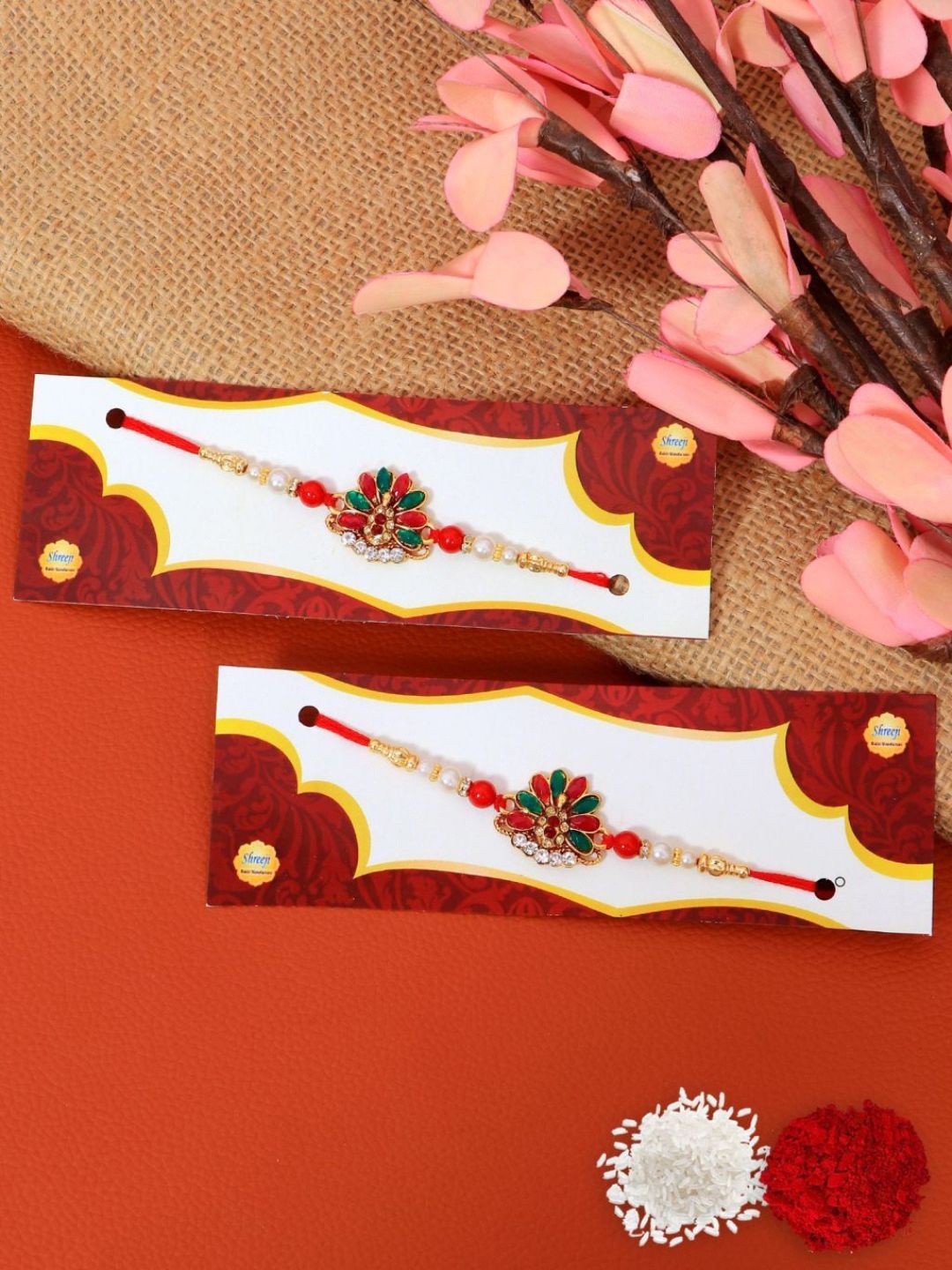 

Crunchy Fashion Set Of 2 Kundan Studded Floral Rakhi With Roli Chawal, Red