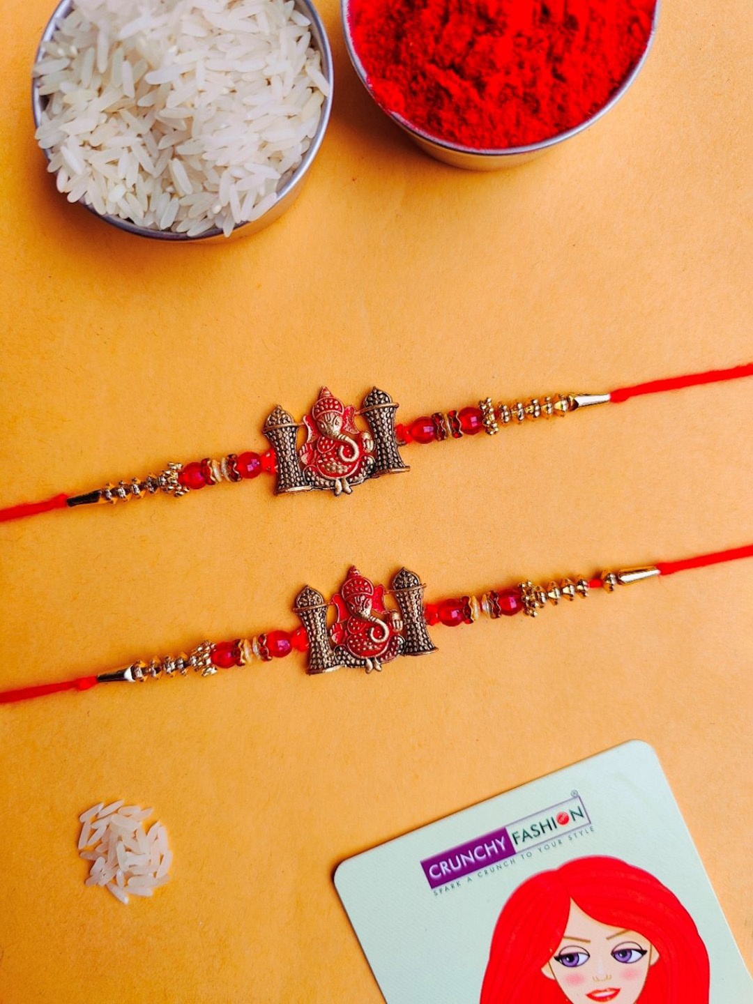 

Crunchy Fashion Set Of 2 Lord Ganesha Oxidized Thread Rakhi With Roli Chawal, Red