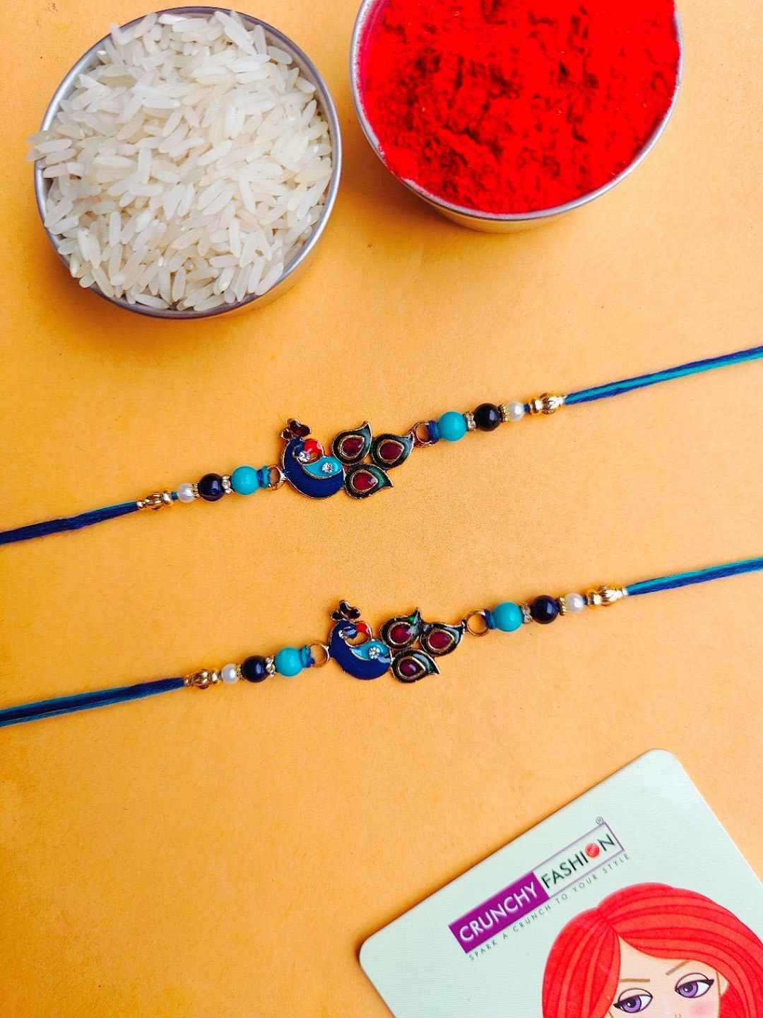 

Crunchy Fashion Set Of 2 Peacock Design Thread Rakhi With Roli Chawal, Gold